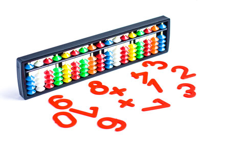 Japanese traditional calculator abacus and numbers on white
