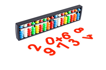 Japanese traditional calculator abacus and numbers on whiteの写真素材