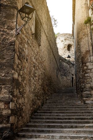 Narrow street in old town. Girona, Catalonia, Spain. Empty street in quarantineの写真素材