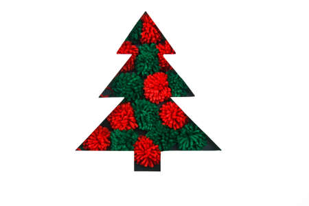 Red and green pompoms in cut paper in fir-tree shape for christmas card or new year background. Knitting. Greeting for needlewomenの写真素材