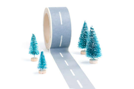 Tape with painted asphalt and trees on whiteの写真素材