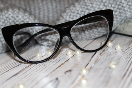 Fashion glasses on a wooden white backgroundの写真素材