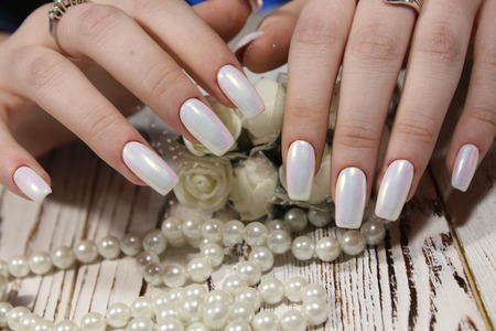 sexy manicure on long nails on a beautiful backgroundの写真素材