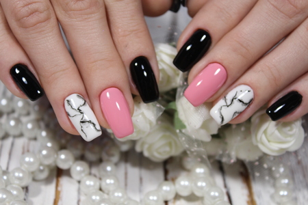 glamorous beautiful manicure on a trendy texture backgroundの写真素材