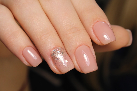 beautiful French manicure on a trendy texture backgroundの写真素材