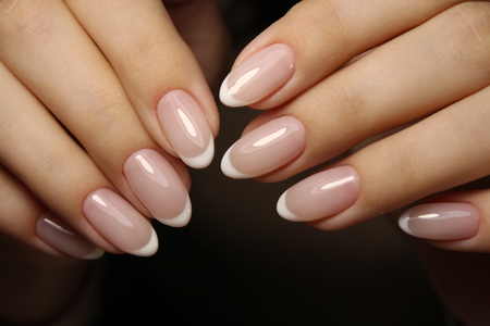 beautiful long nails on a white backgroundの写真素材
