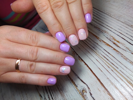 beautiful gel lacquer manicure on a textured trendy backgroundの写真素材