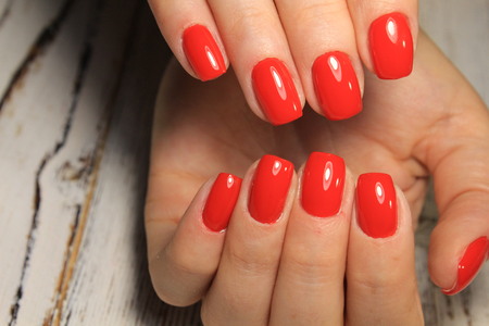 fashionable red manicure on long beautiful nailsの写真素材