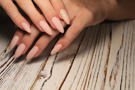 fashionable french manicure on beautiful female handsの写真素材