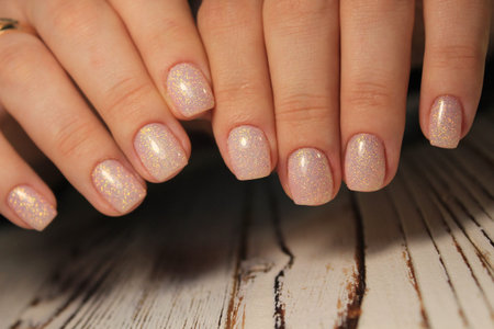 beautiful French manicure on a trendy texture background