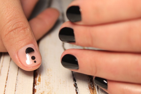 beautiful nail art manicure on the background of a fashionable textureの写真素材