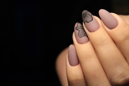 Beautiful nail design on female hands on background.の写真素材