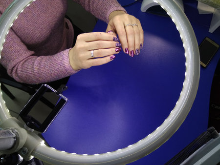 Stylish manicure nails on a beautiful textural background