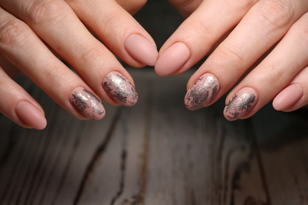 glamorous beautiful manicure on a trendy texture backgroundの写真素材