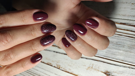 fashionable beige manicure with a silver pattern design