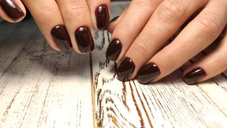 Amazing natural nails. Women's hands with clean manicure. Gel polish applied.の写真素材