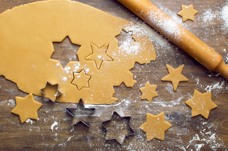 Dough for baking ginger biscuits. Forms for slicing gingerbread. Skalka for dough and flour.の写真素材