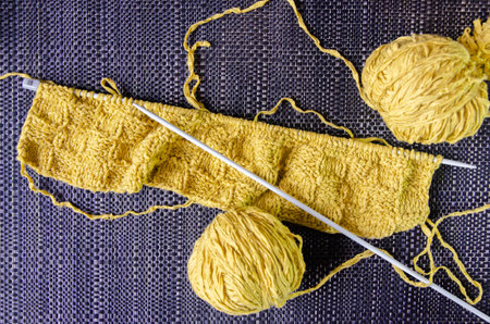 Manual knitting on spokes. Top view.