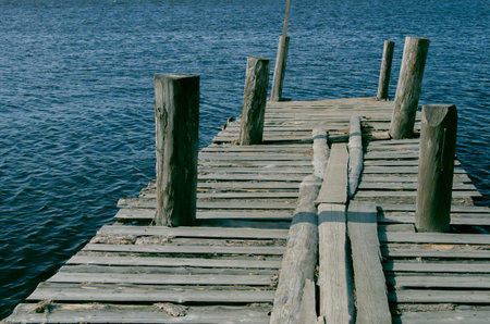 Beautiful view of the pier, going into the blue water.の写真素材