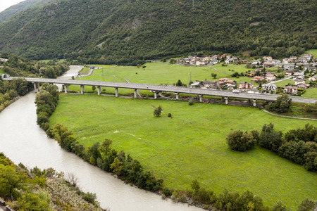 The bridge over the river in the mountainsの写真素材