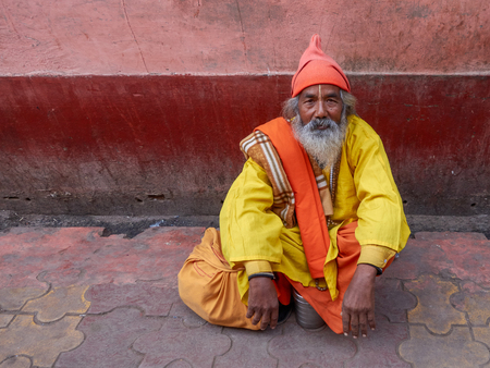 VRINDAVAN, INDIA â  "December 15, 2014: Â A lonely sadhu with a deep, careful, serene gaze sitting on the ground in the sacred city of Vrindavanのeditorial素材