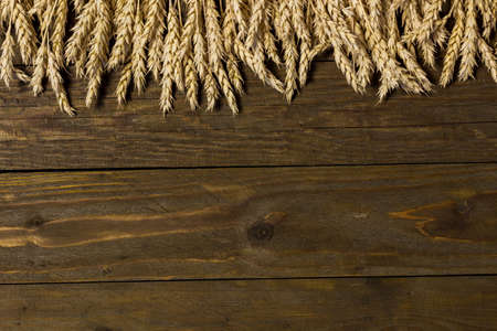 arrangement of wheat ears on the table for design with copy spaceの写真素材