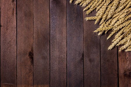 arrangement of wheat ears on the table for design with copy spaceの写真素材