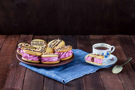 French tea party in a rustic style, homemade tender marshmallows with cookies, on a wooden tableの写真素材