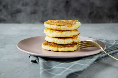 Fried curd cheese pancakes. Healthy, delicious kids food for the whole family. Serving lunch, close-upの写真素材