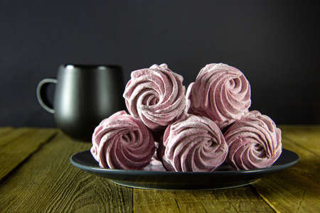 Gentle homemade marshmallow on a wooden background. Health food. Delicious breakfast, low in calories.の写真素材
