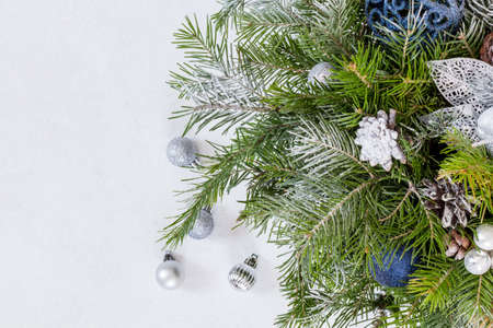 Fir branches, thuja branch, pine cones, and christmas balls on white background.の写真素材