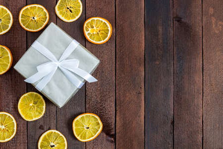 New Year card with balls and oranges and spruce and handmade gift box. top viewの写真素材