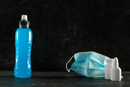 a bottle of isotonic energy drink on a dark background, a drink