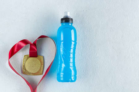 a bottle of isotonic energy drink, sport will beat diseasesの写真素材