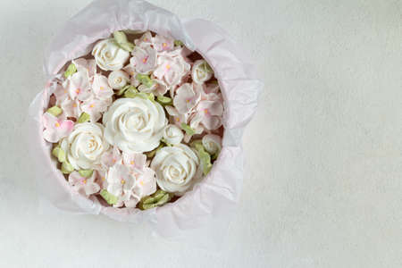 Zephyr bouquet of flowers in a pink box on a gray backgroundの写真素材
