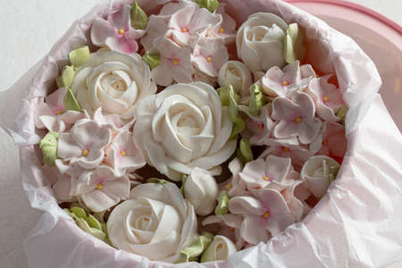 Zephyr bouquet of flowers in a pink box on a gray backgroundの写真素材