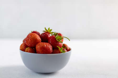 Ripe strawberries on a light background, space for copying, close-upの写真素材