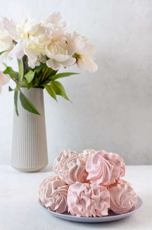 Homemade pink strawberry zephyr or marshmallow on a wooden table. selective focus. the concept of delicious healthy natural foodの写真素材