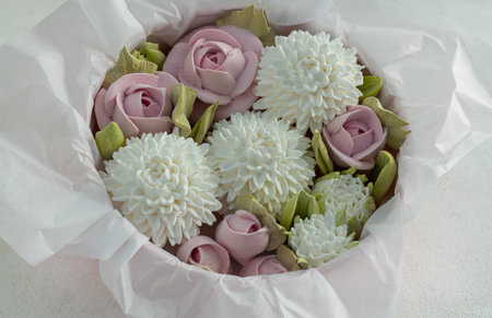Zephyr bouquet of flowers in a gift box on a light background, Valentine's Dayの写真素材