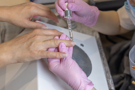 Nails manicure detail with file or brush item. Woman beautiful nail care process.の写真素材