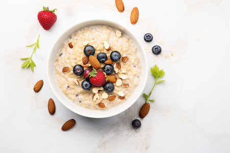 Oatmeal with Berries and Nuts, Healthy oatmeal served with berries, almonds and honey. An image of oatmeal for the menu.の素材