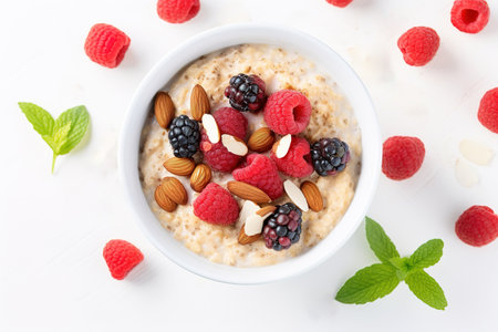 Oatmeal with Berries and Nuts, Healthy oatmeal served with berries, almonds and honey. An image of oatmeal for the menu.の素材
