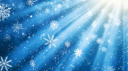 Blue background with white snowflakes and rays of light. Space for text. Winter season, holiday celebration.の素材