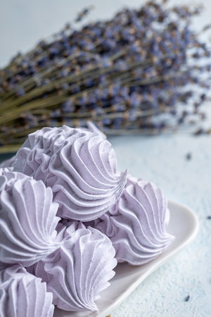 Homemade lavender zephyr displayed on a light background, highlighting soft textures and pastel hues, ideal for culinary inspiration and dessert presentationsの写真素材