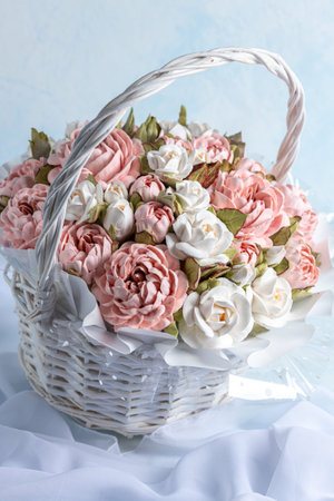 Beautiful arrangement of pink and white marshmallow flowers in a woven basket, showcasing intricate details and soft textures, perfect for decorative purposes and floral artistryの写真素材