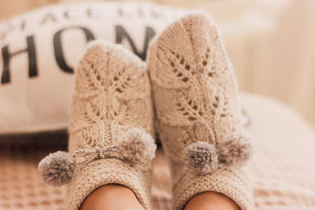 Handmade knitted socks on the legs. High quality photoの写真素材
