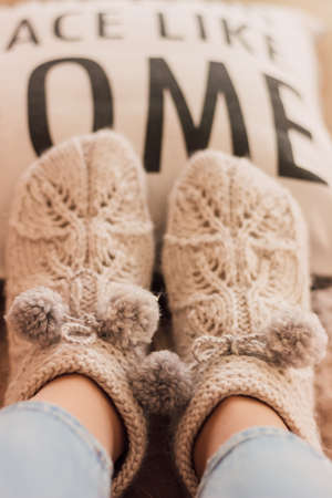 Handmade knitted socks on the legsの写真素材