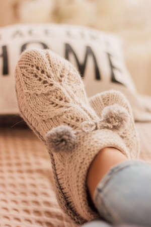 Handmade knitted socks on the legsの写真素材