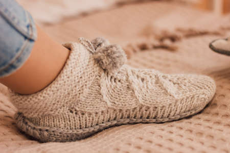 Handmade knitted socks on the legsの写真素材