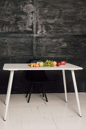 Vegetables and fruits are on a white tableの写真素材